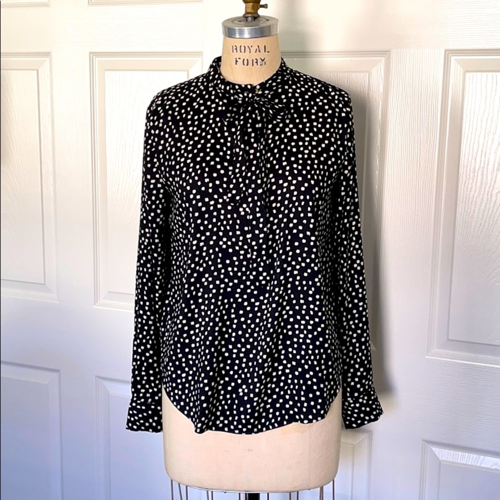 Flowy polka dot blouse with tie.